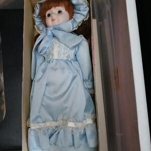 Blue Porcelain Doll with Lace Accents